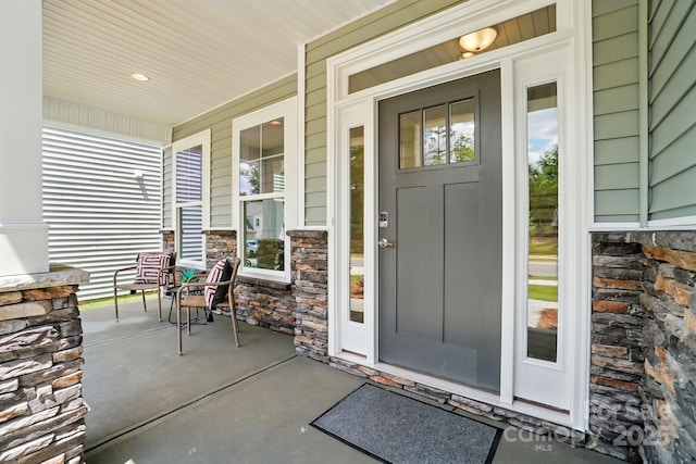 5230 Verona Rd Unit 80, Charlotte, NC 28213 - property entrance featuring a porch and stone siding