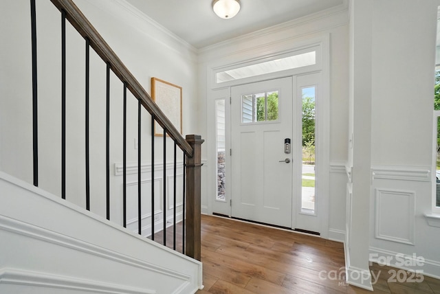 5230 Verona Rd Unit 80, Charlotte, NC 28213 - entrance foyer featuring a decorative wall, hardwood / wood-style flooring, stairs, ornamental molding, and wainscoting