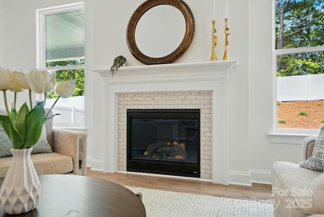 5230 Verona Rd Unit 80, Charlotte, NC 28213 - detailed view of a brick fireplace, wood finished floors, and baseboards