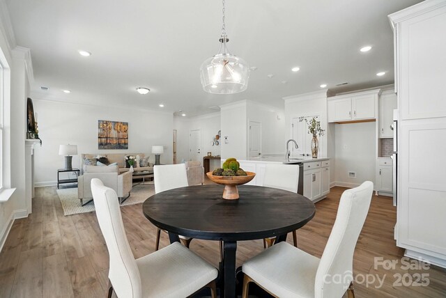 5230 Verona Rd Unit 80, Charlotte, NC 28213 - dining area featuring recessed lighting, light wood-style floors, baseboards, and ornamental molding