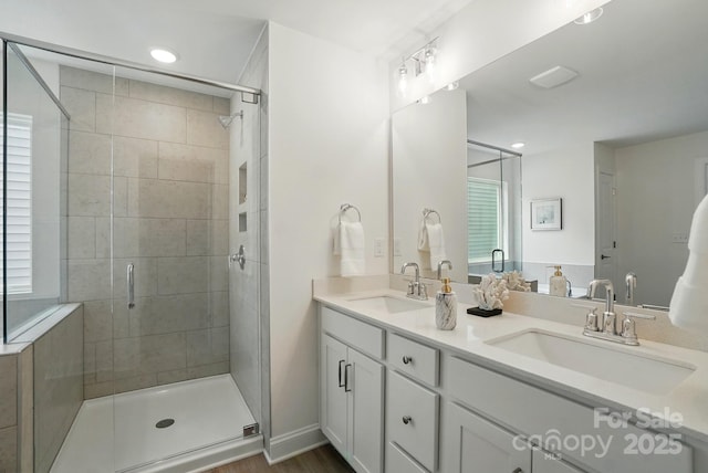 5230 Verona Rd Unit 80, Charlotte, NC 28213 - bathroom with a shower stall, double vanity, recessed lighting, and wood finished floors