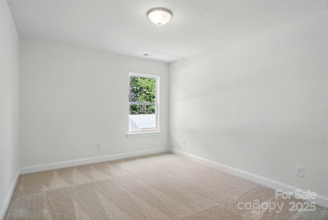 5230 Verona Rd Unit 80, Charlotte, NC 28213 - spare room with baseboards and carpet floors