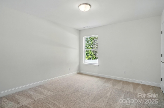 5230 Verona Rd Unit 80, Charlotte, NC 28213 - spare room with baseboards and light carpet