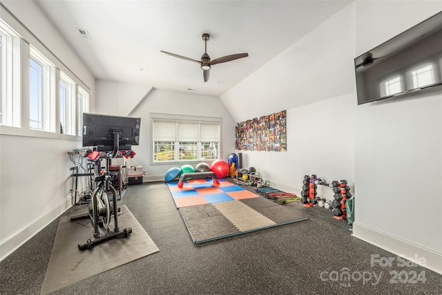 exercise area featuring lofted ceiling, ceiling fan, and a healthy amount of sunlight