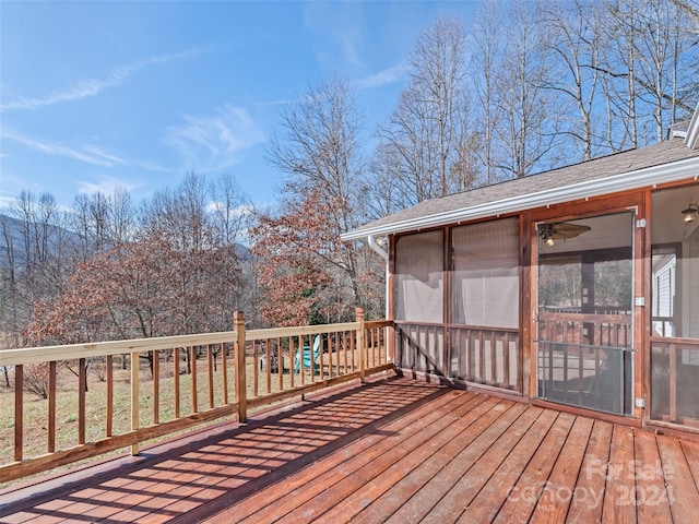 deck with a sunroom