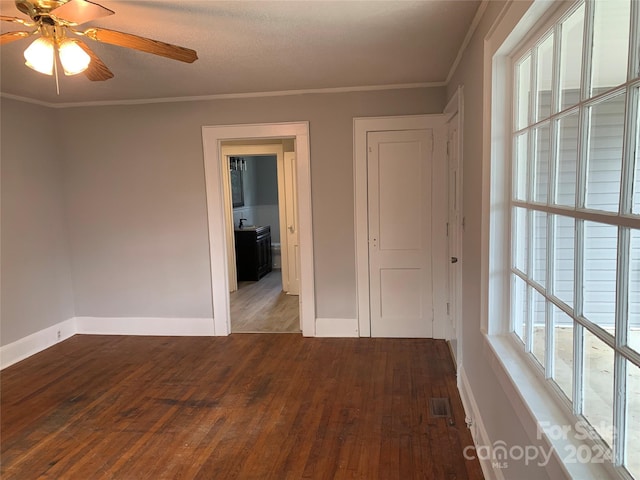 unfurnished room with hardwood / wood-style floors, ceiling fan, and ornamental molding