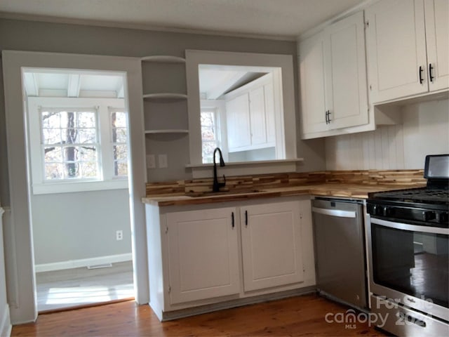 kitchen featuring white cabinets, sink, and stainless steel appliances