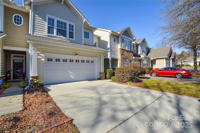 townhome / multi-family property featuring a garage