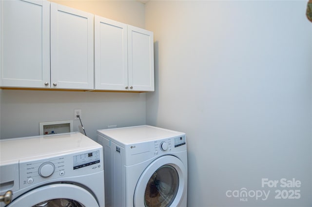 clothes washing area featuring independent washer and dryer and cabinets