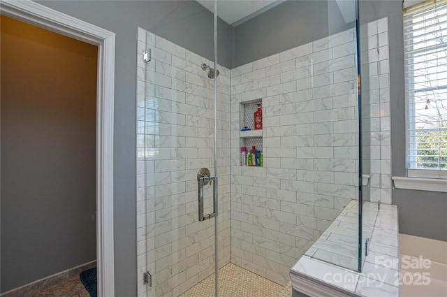 bathroom featuring a shower with door