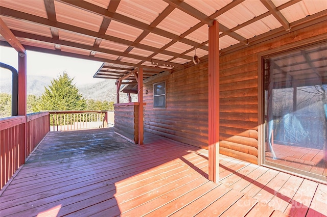 wooden deck featuring a mountain view