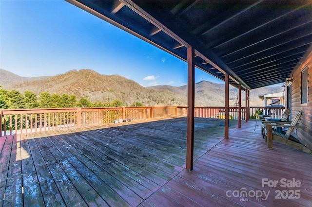 wooden terrace with a mountain view