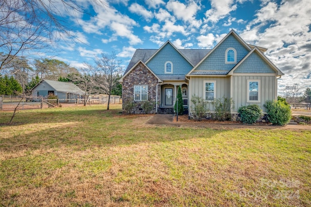 craftsman-style house with a front lawn