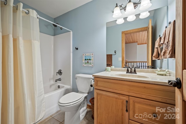 full bathroom with shower / bath combo with shower curtain, tile patterned flooring, vanity, and toilet