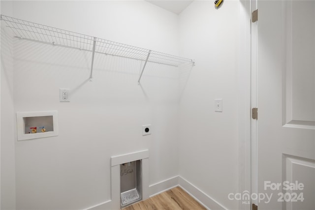 laundry area with hookup for an electric dryer, wood-type flooring, and hookup for a washing machine