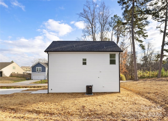 view of side of property featuring central air condition unit