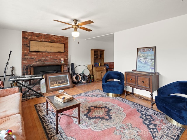 living room with light wood-type flooring and ceiling fan