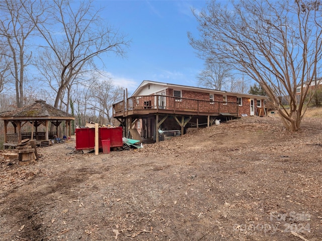 back of house featuring a gazebo and a wooden deck