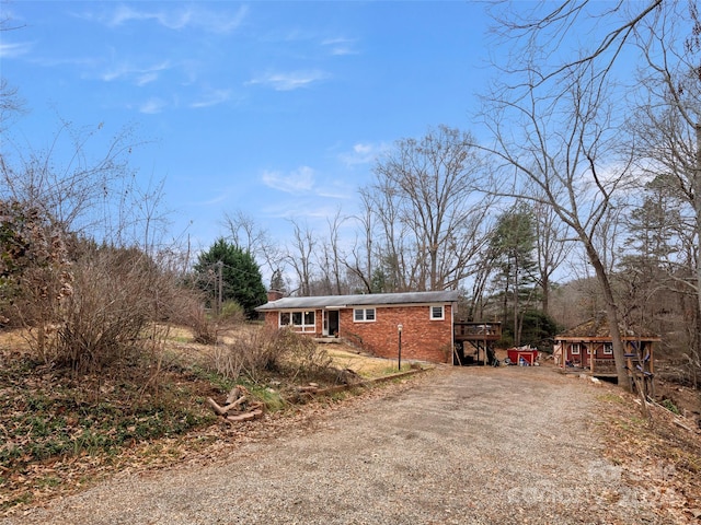 view of side of home with a deck