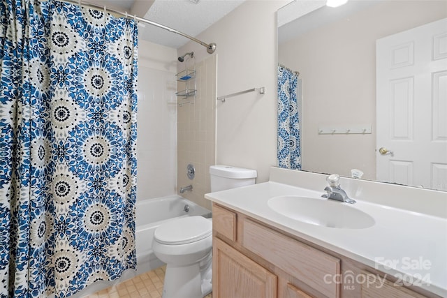 bathroom featuring vanity, a textured ceiling, and toilet