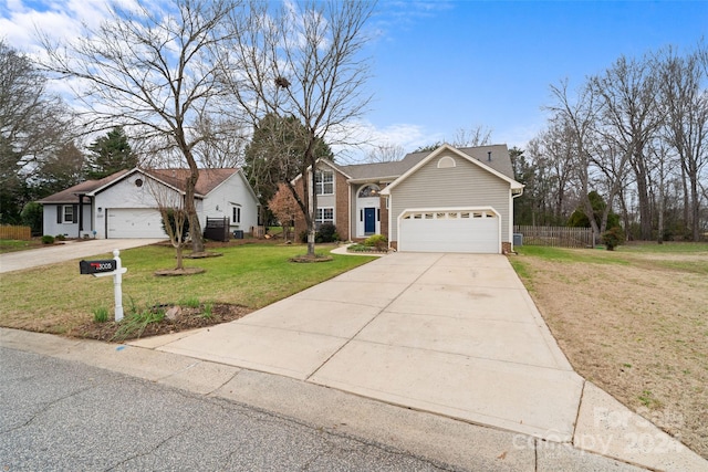 ranch-style home with a front yard and a garage