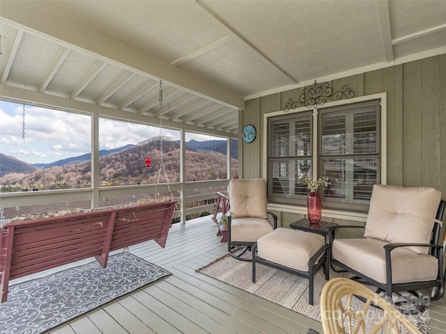 sunroom with a mountain view