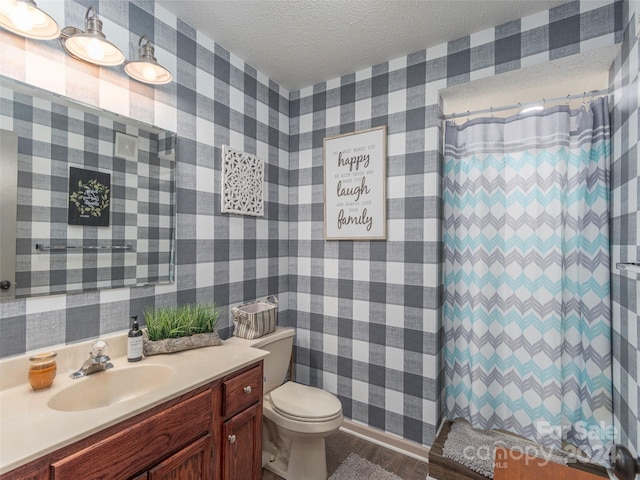 bathroom with a shower with curtain, wood-type flooring, a textured ceiling, toilet, and vanity