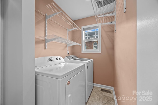 113 Burton St, Asheville, NC 28806 - washroom featuring visible vents, baseboards, washer and dryer, and laundry area