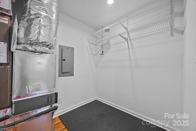 113 Burton St, Asheville, NC 28806 - spacious closet with electric panel, heating unit, and wood finished floors