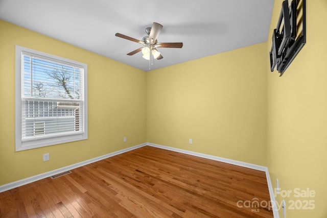 113 Burton St, Asheville, NC 28806 - spare room with wood finished floors, visible vents, baseboards, and ceiling fan
