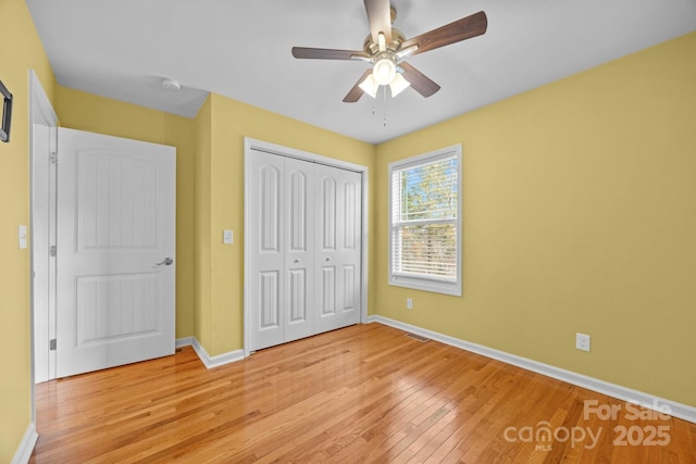 113 Burton St, Asheville, NC 28806 - unfurnished bedroom featuring visible vents, baseboards, light wood-style floors, and a closet