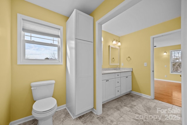 113 Burton St, Asheville, NC 28806 - bathroom with baseboards, vanity, and toilet