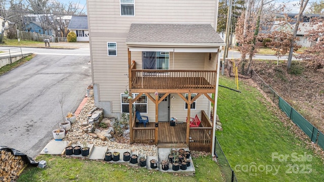 113 Burton St, Asheville, NC 28806 - back of house featuring a wooden deck, a shingled roof, fence private yard, and a yard
