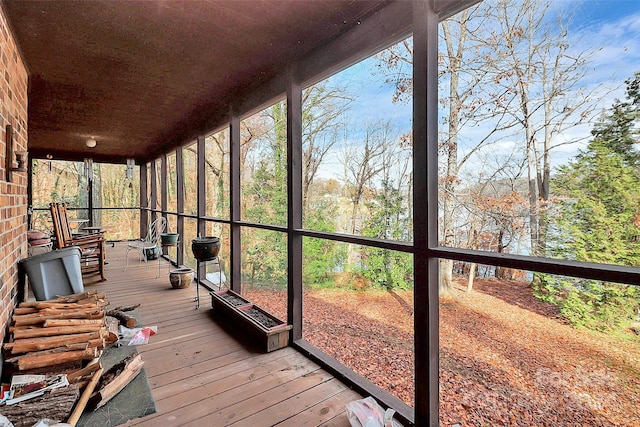 unfurnished sunroom featuring a healthy amount of sunlight