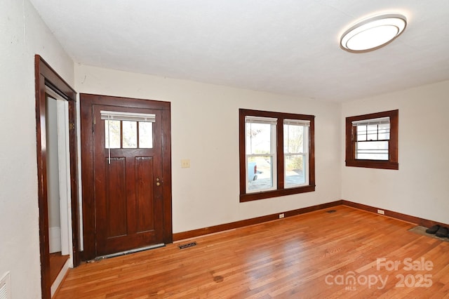 entryway with light hardwood / wood-style flooring