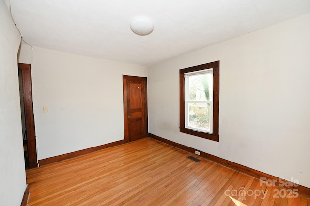 unfurnished room featuring light hardwood / wood-style flooring