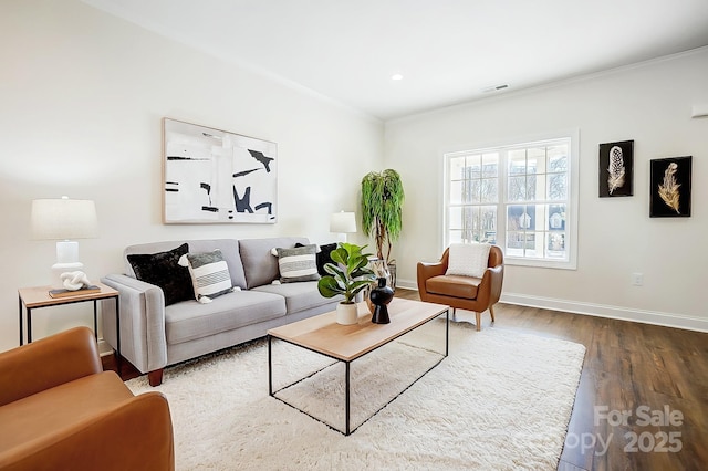 living room featuring dark hardwood / wood-style floors and ornamental molding