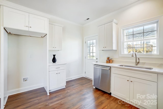 kitchen featuring dark hardwood / wood-style flooring, stainless steel dishwasher, sink, white cabinets, and plenty of natural light