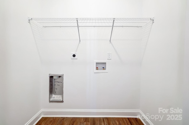 laundry area with electric dryer hookup, dark hardwood / wood-style floors, and hookup for a washing machine