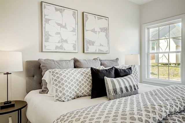 bedroom featuring multiple windows