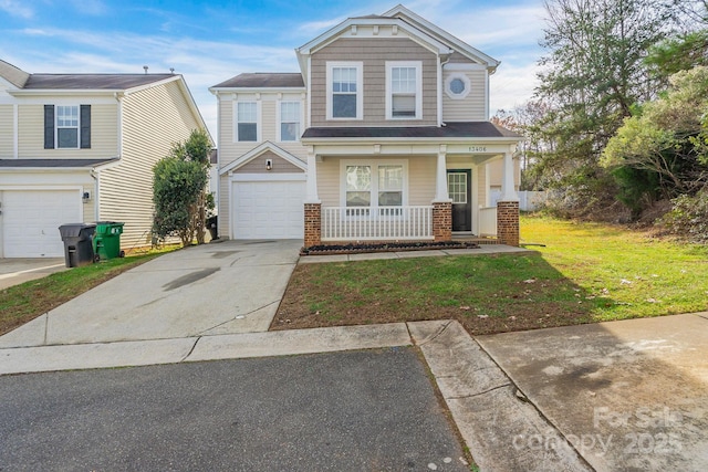 view of front of home featuring a garage, covered porch, and a front lawn