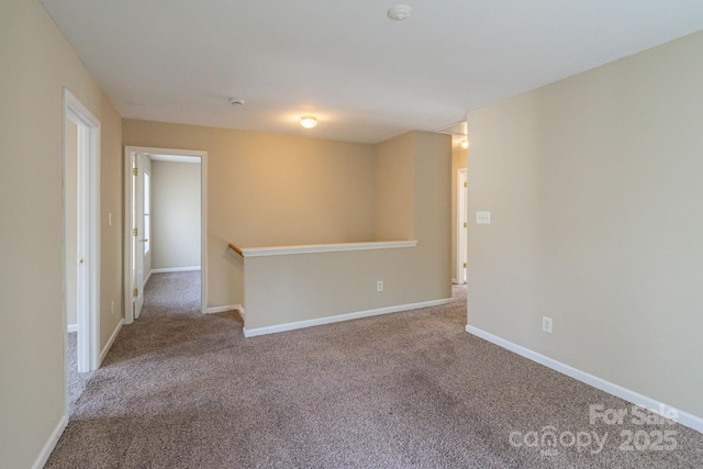 empty room with carpet flooring