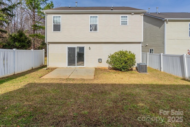 rear view of property with a yard, central AC unit, and a patio area