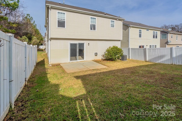 back of house with cooling unit, a patio area, and a lawn