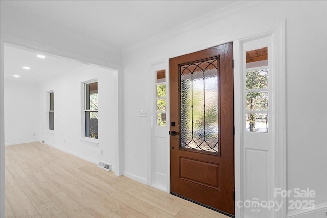 foyer entrance featuring light hardwood / wood-style flooring