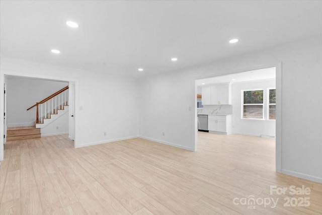 unfurnished living room featuring light wood-type flooring