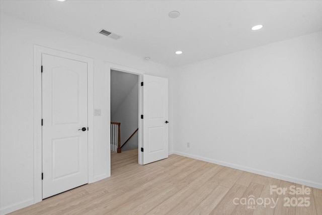 unfurnished bedroom with light hardwood / wood-style floors