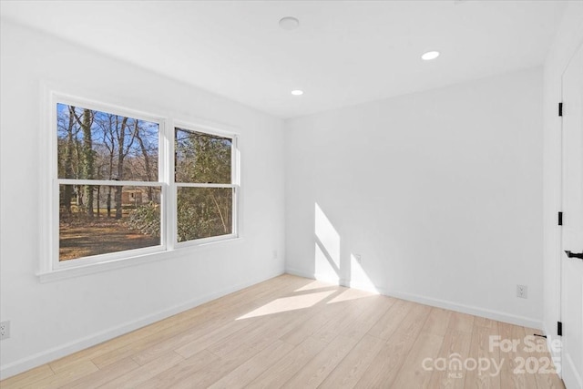 empty room with light hardwood / wood-style floors