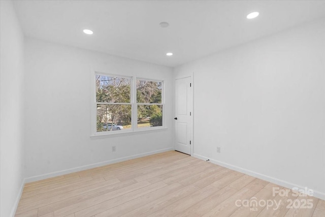 spare room with light wood-type flooring