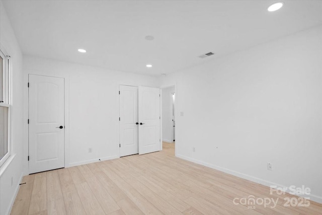 unfurnished room featuring light wood-type flooring